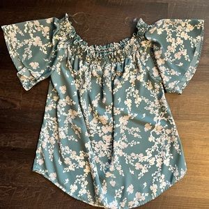 Light blue with a white floral patterned off-the-shoulder blouse